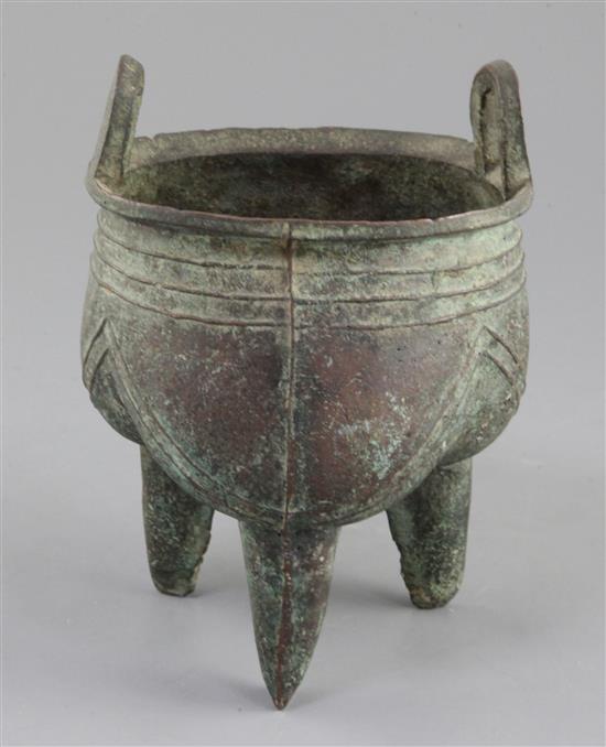 A Chinese archaic bronze tripod ritual vessel, Liding, 12th-11th century B.C., 17.5cm high